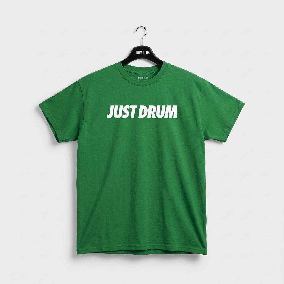 Green Drum Club T-shirt with white Just Drum lettering across the chest, front view.